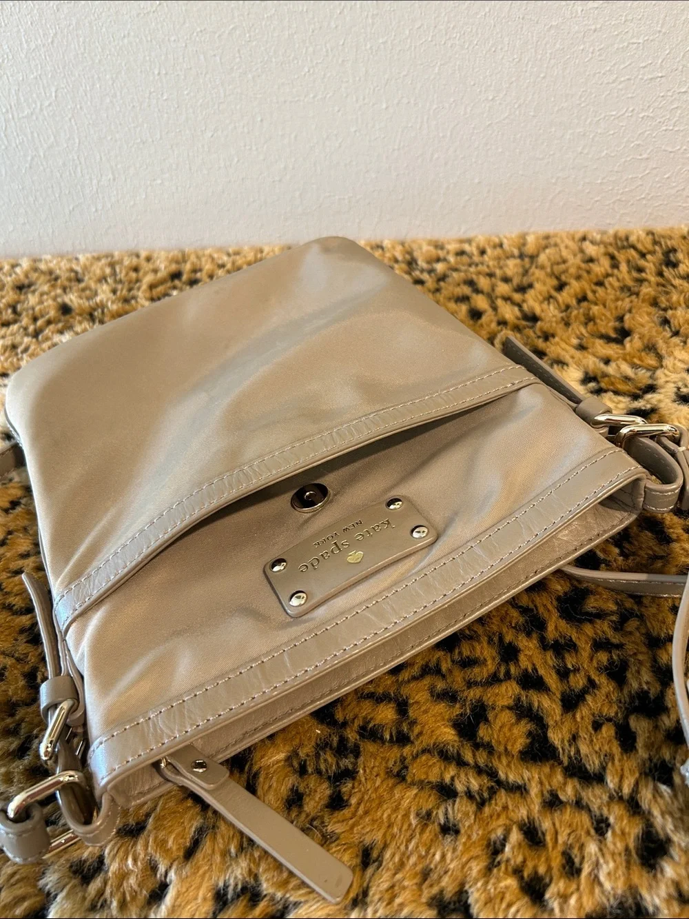 kate spade khaki-green crossbody bag with gold plaque